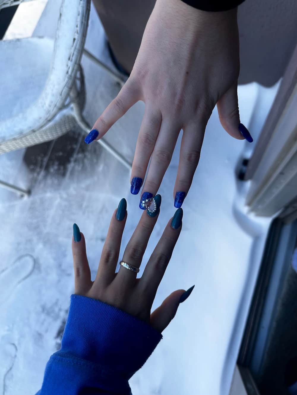 blue nail set with heart design made from gems